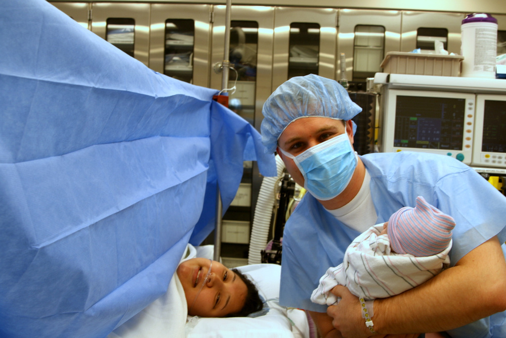 Kristina, Russell, and Zadie in the operating room